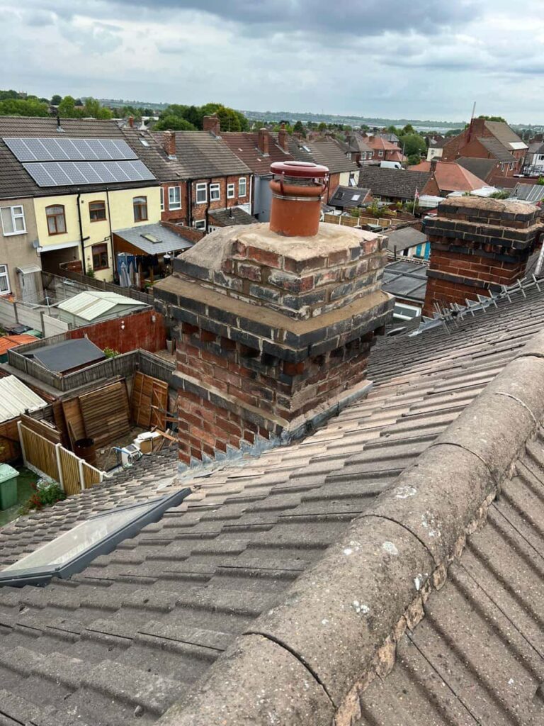 This is a photo taken from a roof which is being repaired by Brierley Hill Roofing Repairs, it shows a street of houses, and their roofs