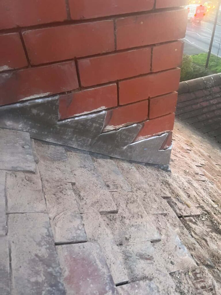 This is a photo of new leadwork being installed around an old chimney. Works carried out by Brierley Hill Roofing Repairs